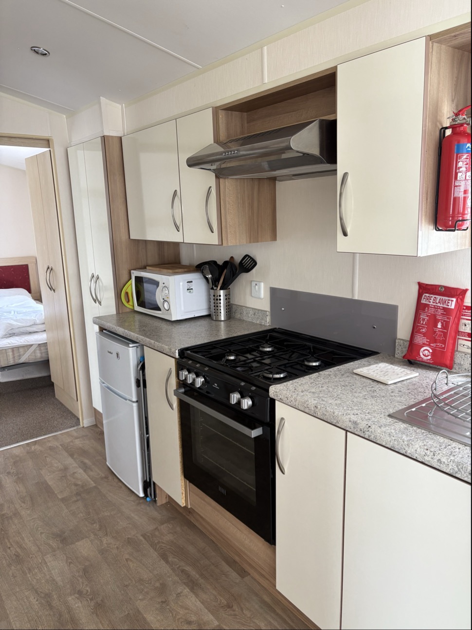 Kitchen with oven, fridge and cabinets