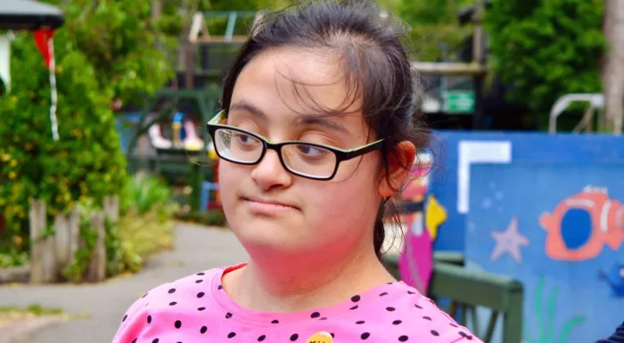 A girl in a spotty t-shirt