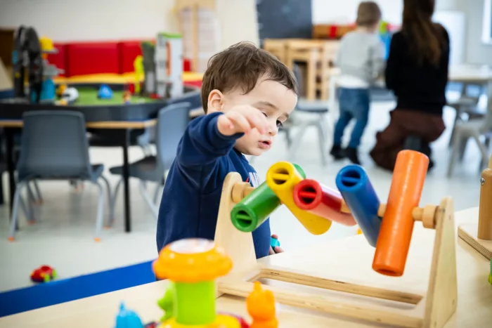 A child is playing with sensory toys at Basingstoke Nursery.