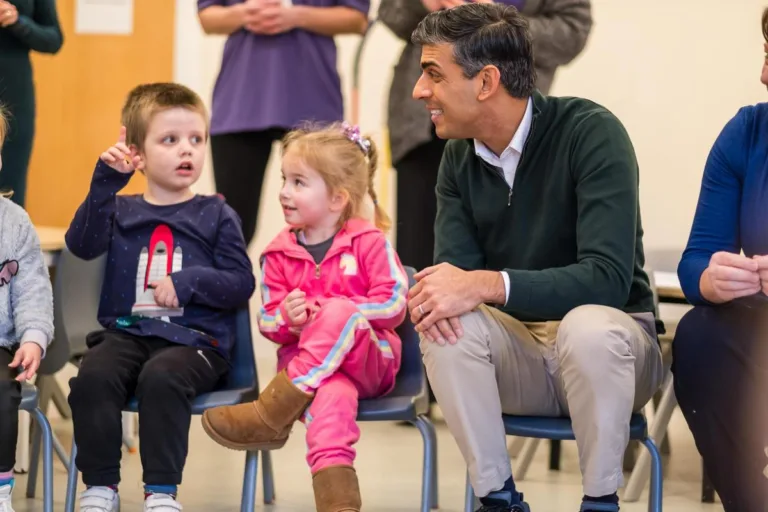 Prime Minister Rishi Sunak sits with children at Kids' Basingstoke Nursery