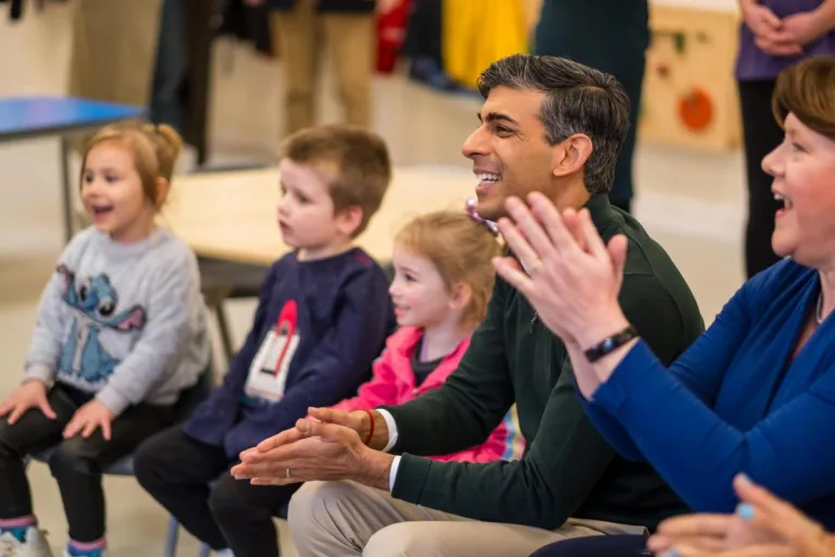 Prime Minister Rishi Sunak sits with children at Kids' Basingstoke Nursery