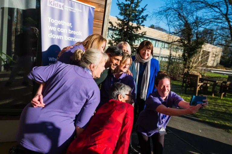 Prime Minister Rishi Sunak takes a selfie with staff at Kids' Basingstoke Nursery