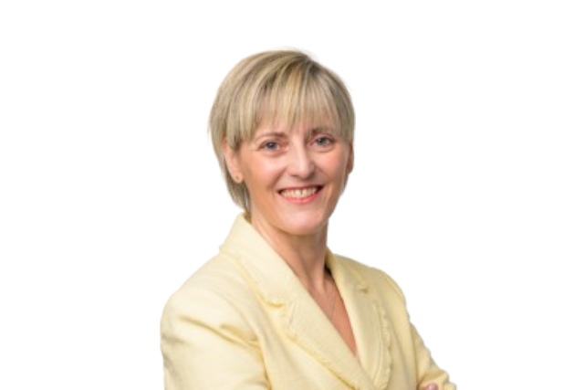 Sam is pictured against a white background wearing a yellow jacket