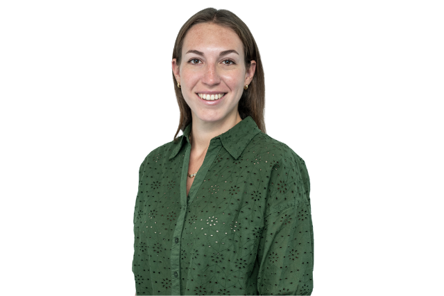 woman wearing a green top smiling