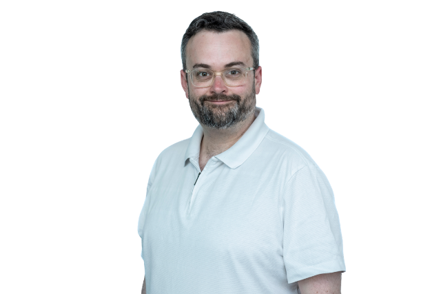 Man wearing a white t shirt smiling