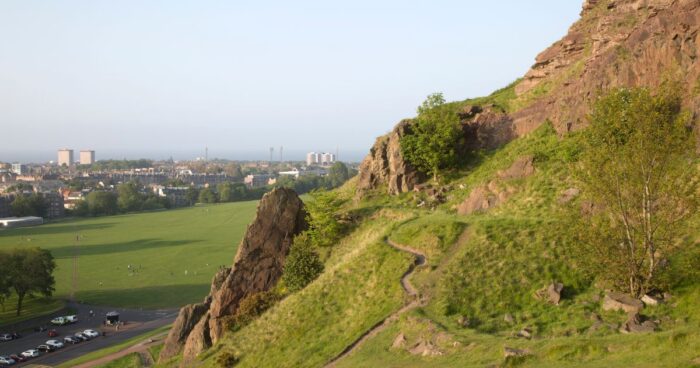 holyrood park from above with the city backdrop