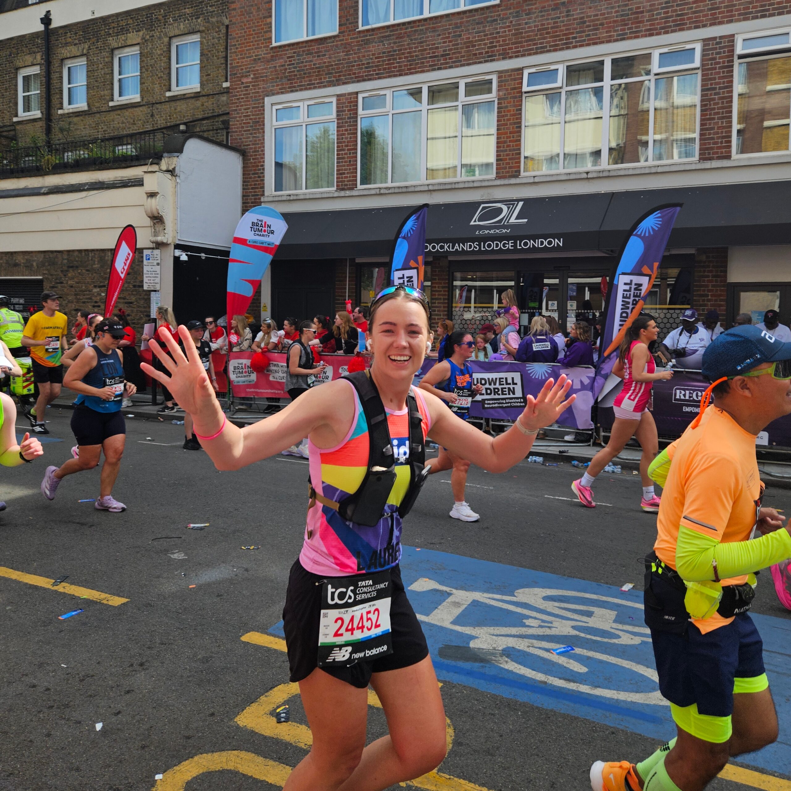 woman smiling as she runs for Kids