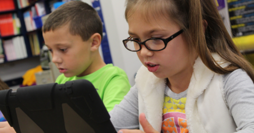 boy and girl on a tablet