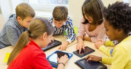 Diverse children with tech